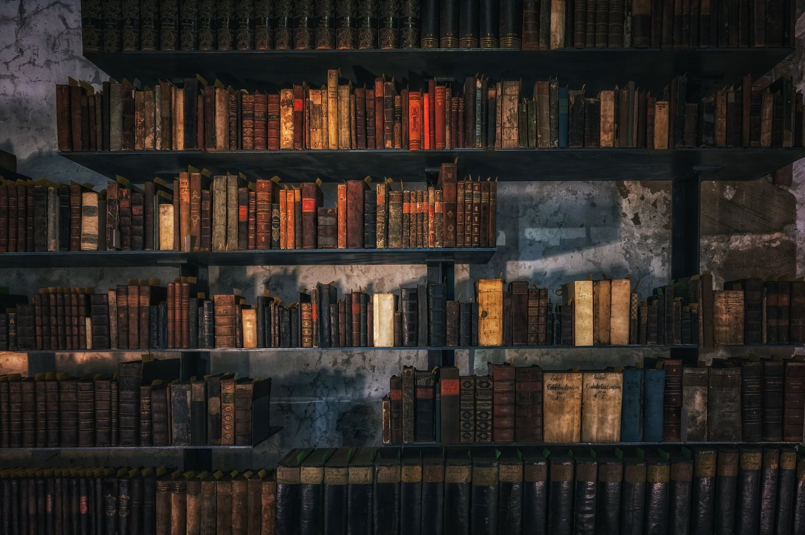Rows of aged, cloth-bound scientific volumes on dark library shelves